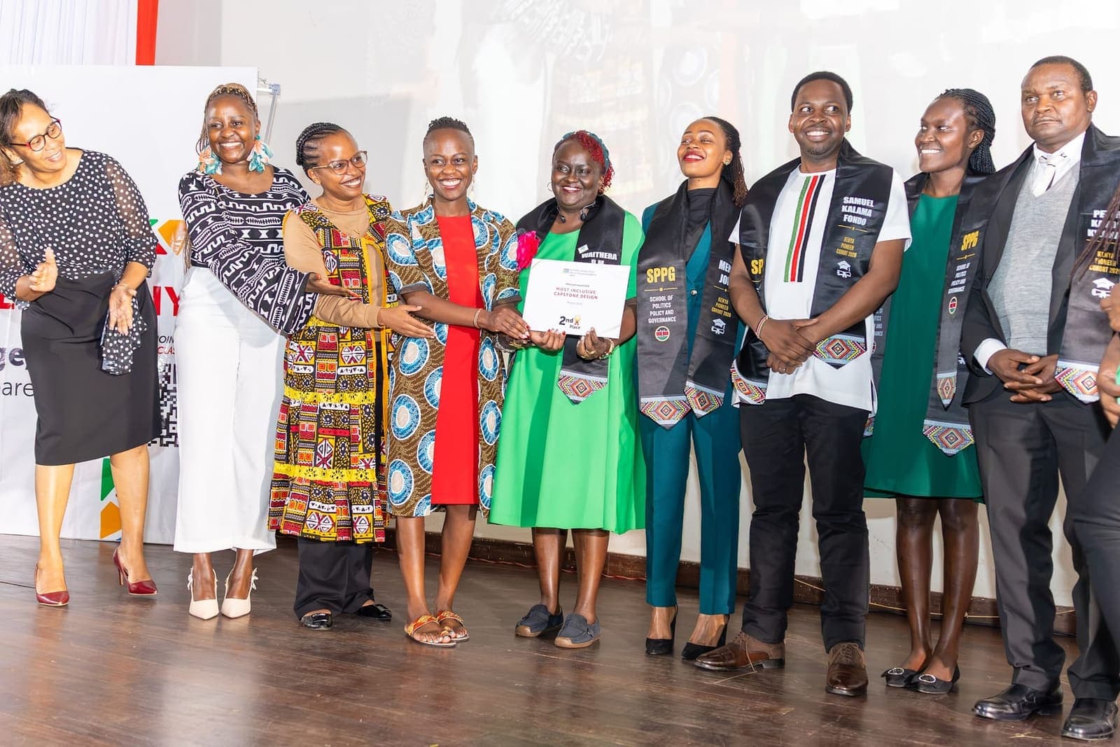 Graduates with their certificates