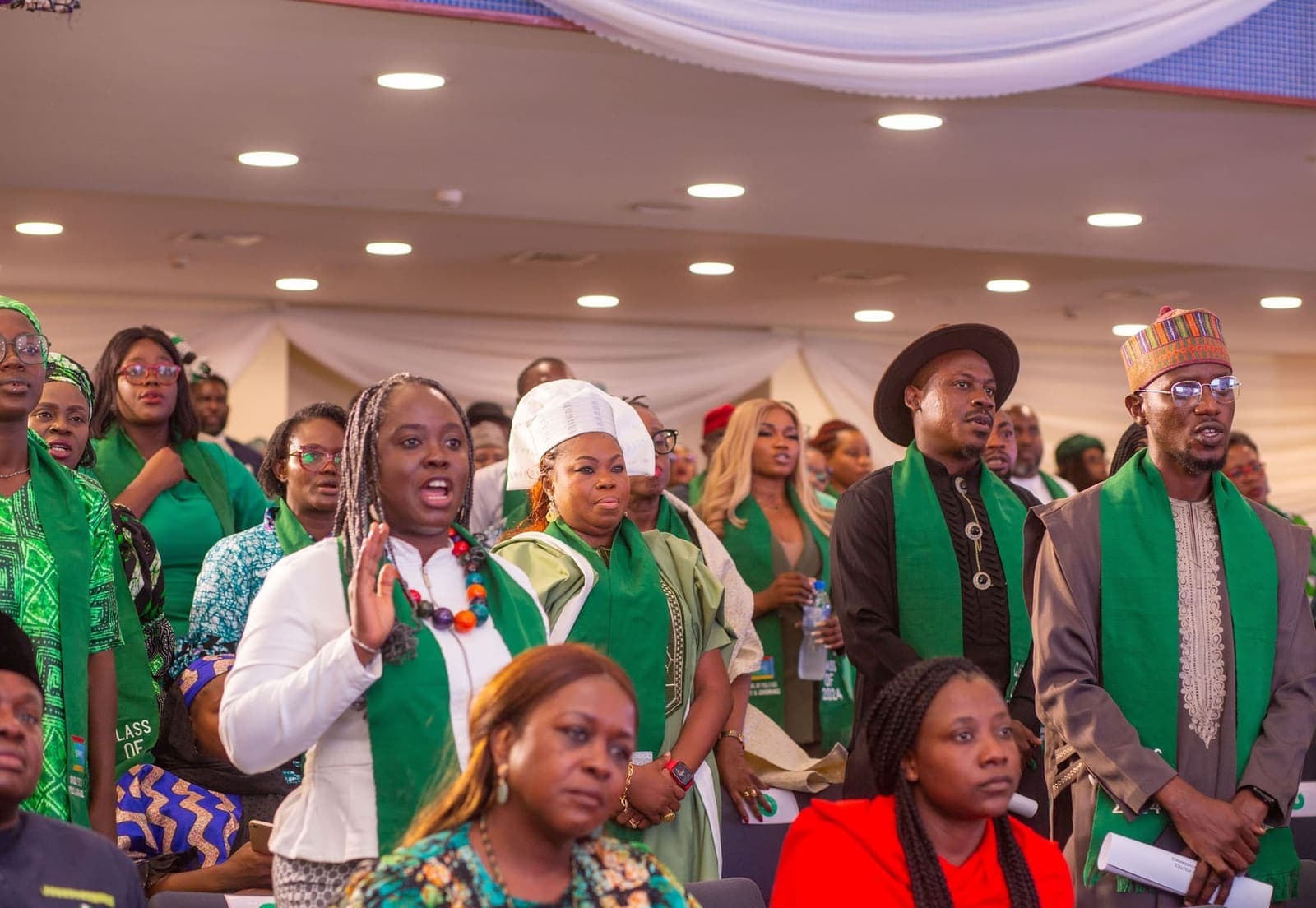 Graduands cheer as the ceremony begins