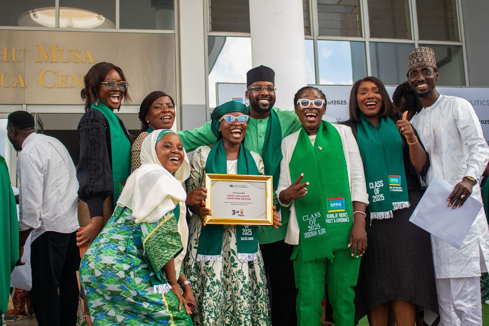 Graduates with their award